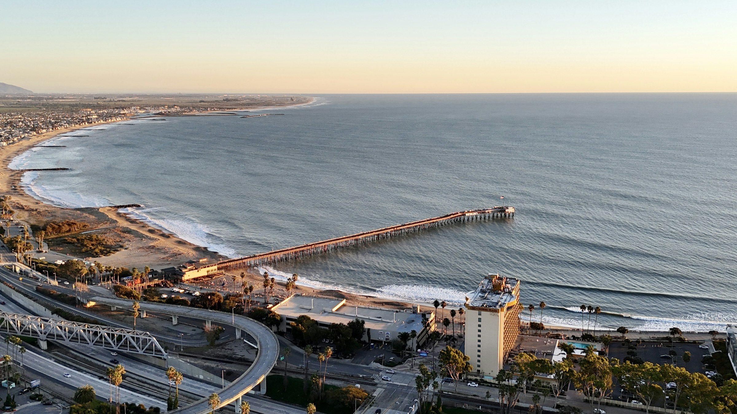 Aerial view of Ventura Pier and the Pacific coastline at golden hour